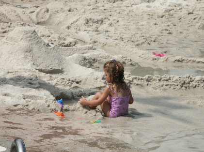 Maddy is still playing in the sand