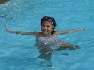 Maddy poses in the pool