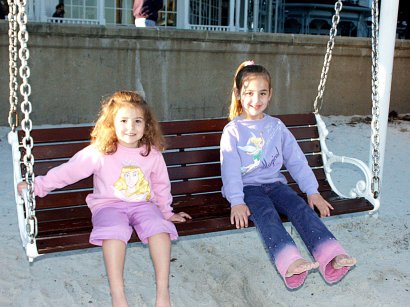 Girls on a swing at GF Beach