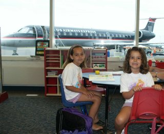 Waiting in the airport with our plane outside