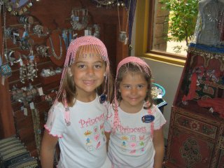 Trying on headpieces in Morocco