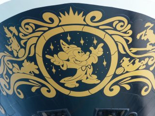 Mickey on bow of ship